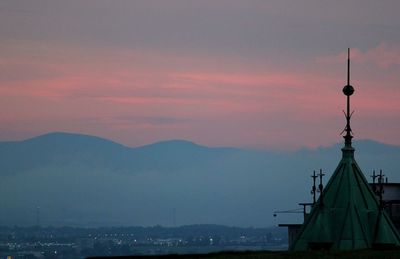 Low angle view of building against sky during sunset