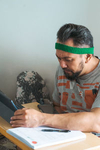 Portrait of boy using laptop at home