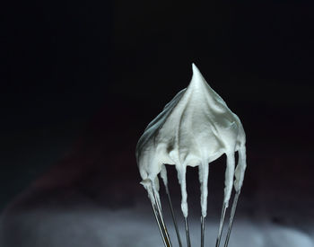 Close-up of leaf against black background