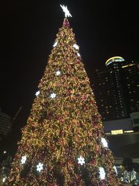 Low angle view of illuminated christmas tree