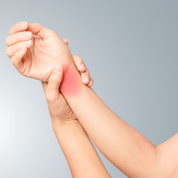 Low section of woman against white background