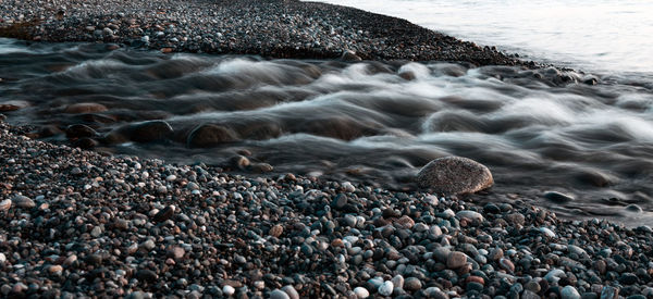 High angle view of pebbles on beach