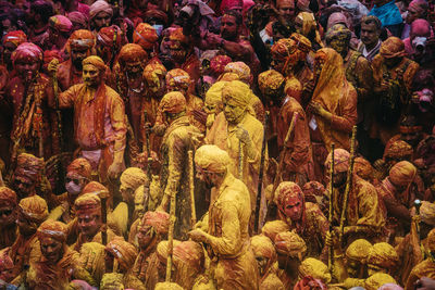 People playing holi in city