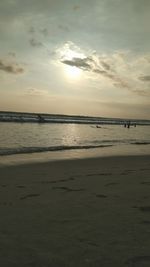 Scenic view of sea against cloudy sky