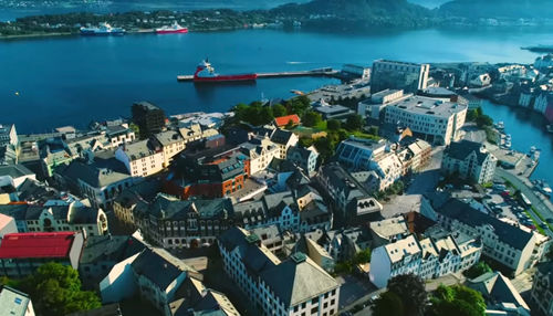High angle view of townscape by sea