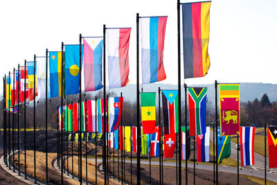 Multi colored flags against clear sky