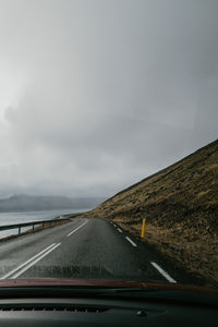 Empty road against sky