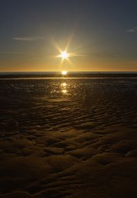 Scenic view of sea against sky at sunset