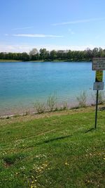 Scenic view of lake against cloudy sky