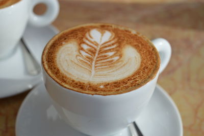 Close-up of coffee cup on table