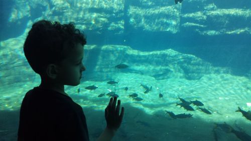 Young woman swimming in sea