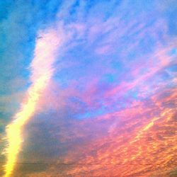 Low angle view of cloudy sky at sunset