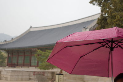 Close-up of red roof against building