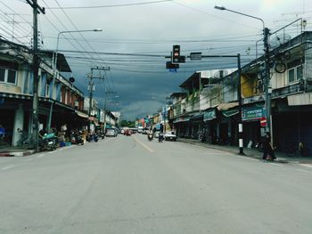 City street and buildings against sky