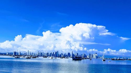 Panoramic view of sea against blue sky