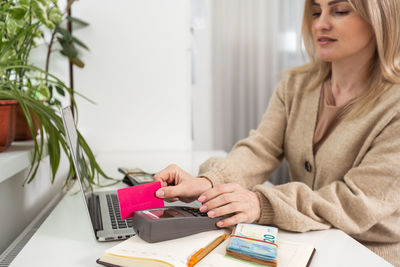 Midsection of woman working at office