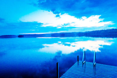 Reflection of clouds in calm lake