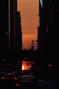 View of city street at sunset