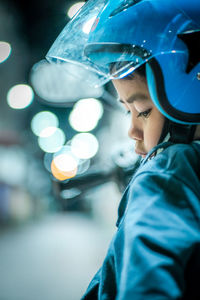 Close-up of boy wearing helmet 