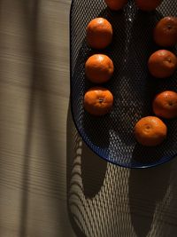 High angle view of orange fruit on table