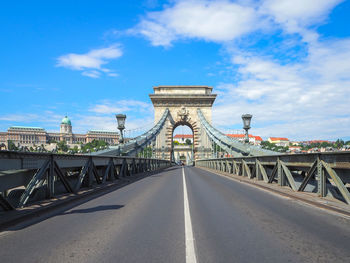 View of bridge against cloudy sky