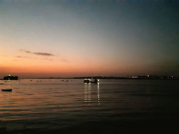 Scenic view of sea against sky at sunset