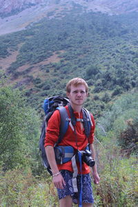 Rear view of man standing on mountain