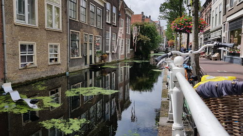 Canal amidst buildings in city