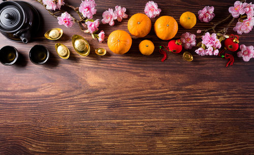 High angle view of various flowers on wooden table