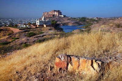 Mid distant view of mehrangarh fort and jaswant thada against clear sky