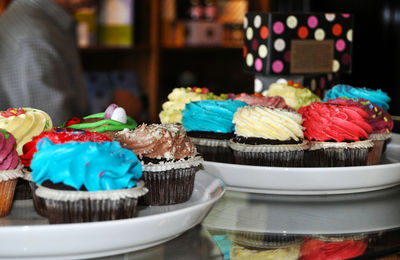 Close-up of cupcakes in plate at store