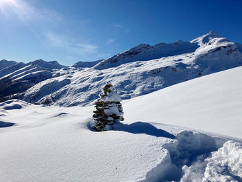Snow covered mountains against sky