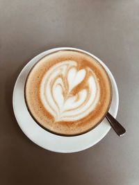 High angle view of cappuccino on table