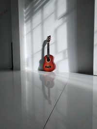 Electric guitar on floor at home