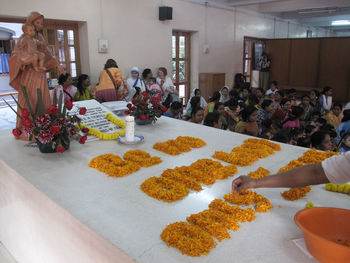 Group of people at market stall