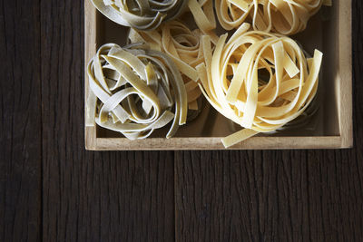 Tagliatelle in box on table