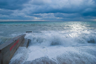 Scenic view of sea against cloudy sky