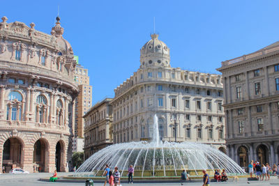 Fountain against piazza de ferrari