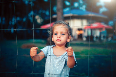 Portrait of cute girl standing outdoors