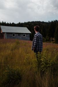 Rear view of man standing on field