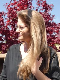 Portrait of beautiful young woman looking away