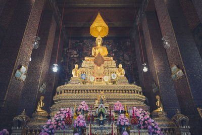 Low angle view of statue against building