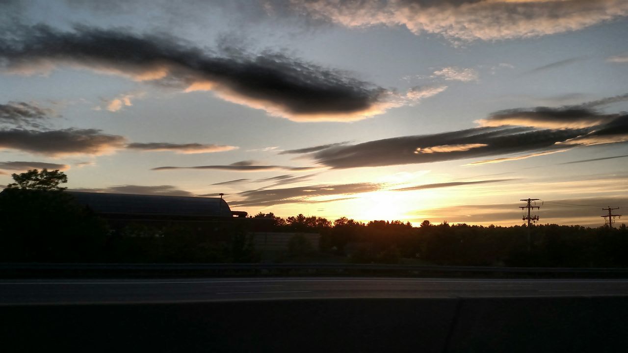 sunset, sky, silhouette, orange color, cloud - sky, tree, scenics, beauty in nature, tranquility, tranquil scene, road, nature, cloud, landscape, idyllic, built structure, cloudy, outdoors, dramatic sky, no people