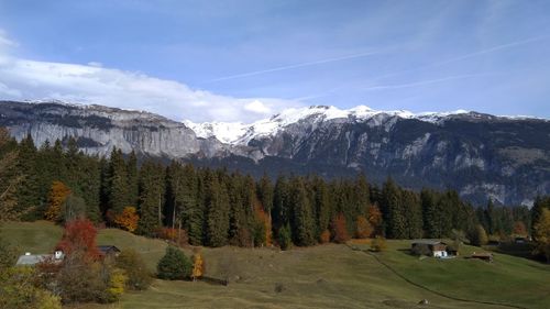 Scenic view of snowcapped mountains against sky