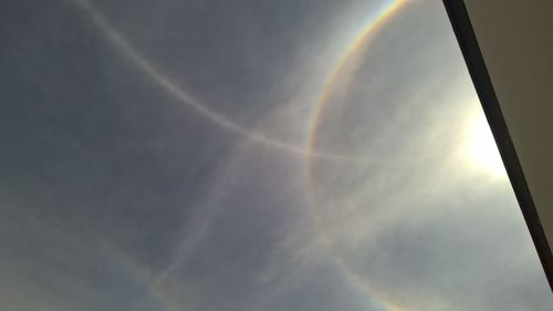 Low angle view of rainbow in sky