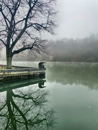 Scenic view of lake against sky during winter