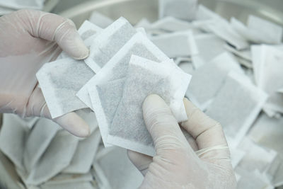 Cropped hand of doctor holding paper currency