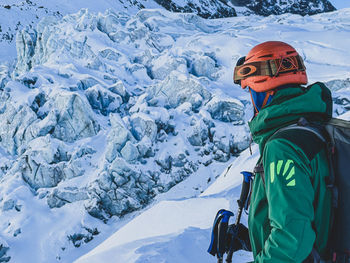 Rear view of man skiing on snow