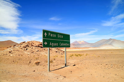 Signpost at the desert road side near salar de aguas calientes salt flats and sico pass, chile