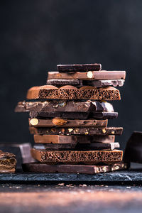 Bar of chocolate tower pieces. hazelnut and almond dark chunks of broken chocolate. 